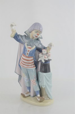 Lot 109 - A Lladro clown, standing beside a magic hat...