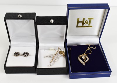 Lot 35 - A 9ct gold heart shaped pendant on a 9ct gold...