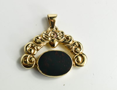 Lot 98 - A 9ct gold swivel fob, the floral and foliate...