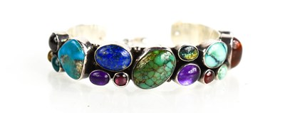 Lot 34 - A Navajo silver and hardstone cuff bangle,...
