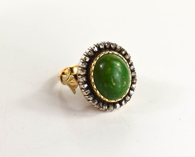 Lot 8 - A 19th century dress ring, set with oval green...