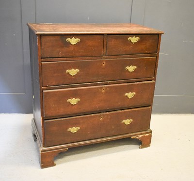 Lot 622 - A Georgian oak chest of drawers, two over...