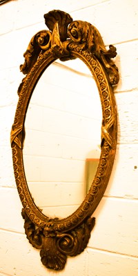 Lot 521 - A large 18th century oval wall mirror with...