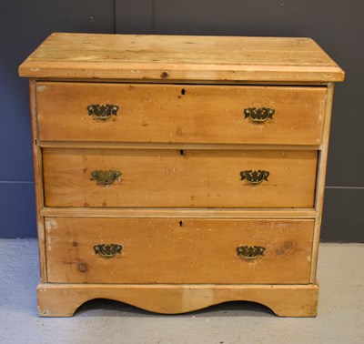 Lot 619 - An antique pine chest of three drawers