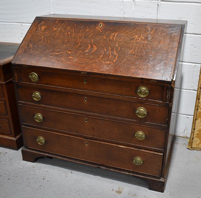 Lot 621 - A Georgian oak bureau with full front...