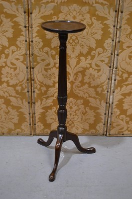 Lot 600 - A mahogany torchere, the reeded baluster stem...