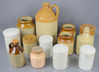 Lot 377 - A group of stoneware apothecary jars and flagon