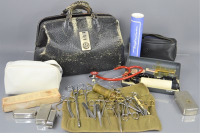 Lot 394 - A vintage leathers doctors bag and equipment...