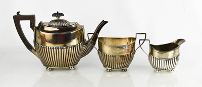 Lot 271 - A silver tea set comprising tea pot, sugar...