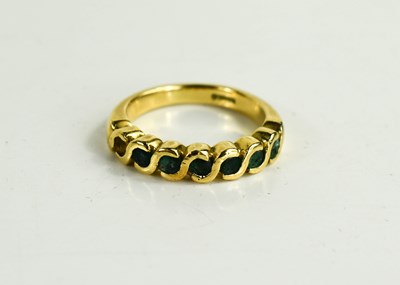 Lot 113 - An 18ct gold and emerald seven stone ring in...