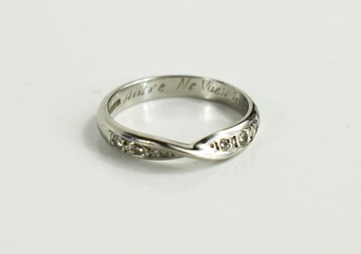 Lot 114 - A 950 platinum and diamond studded wedding...
