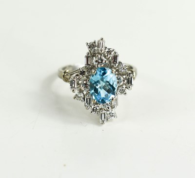 Lot 11 - An 18ct white gold, diamond and topaz dress...