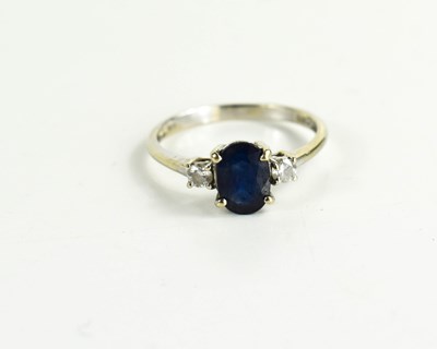 Lot 147 - An 18ct white gold, sapphire and diamond three...