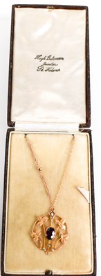 Lot 2 - An Art Nouveau period rose gold, garnet and...
