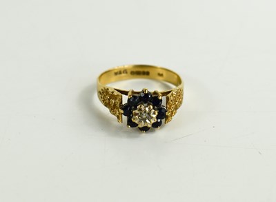 Lot 189 - A 9ct gold, sapphire and diamond flowerhead...