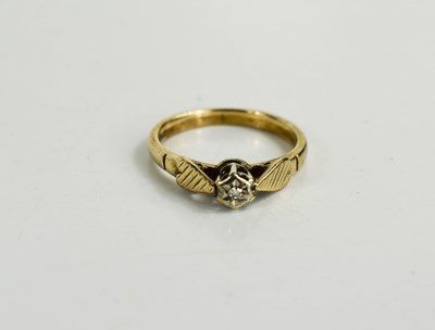 Lot 42 - A 9ct gold and diamond illusion set solitaire...