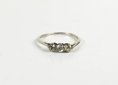 Lot 61 - A white gold (testing as) and diamond three...
