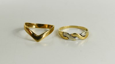 Lot 44 - A 9ct white and yellow gold cross over ring,...