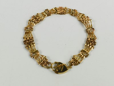 Lot 41 - A 9ct gold gate link bracelet, with heart form...