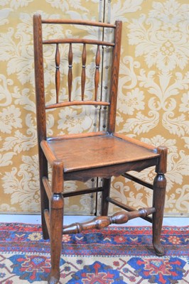 Lot 633 - A 19th century oak country spindle back chair,...
