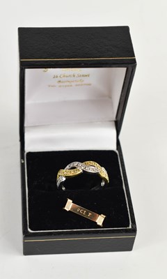 Lot 135 - An 18ct gold, platinum and diamond eternity...