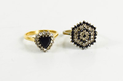 Lot 58 - An 18ct gold, sapphire and diamond heart form...