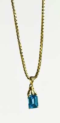 Lot 94 - A 14ct gold and blue topaz pendant, the...