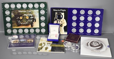 Lot 398 - A group of commemorative coins and crowns,...