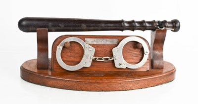 Lot 238 - A presentation truncheon with handcuffs in...