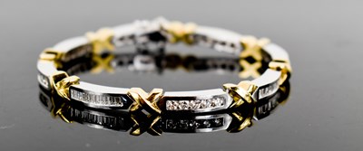 Lot 15 - An 18ct white & yellow gold and diamond...