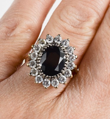 Lot 110 - A 9ct gold, sapphire and diamond ring, the...