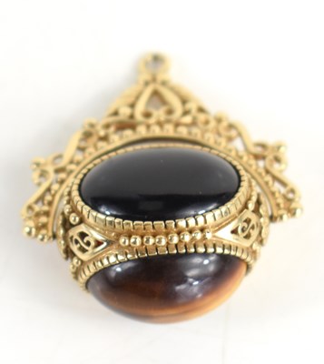Lot 46a - A 9ct gold swivel fob, set with three large...