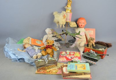 Lot 483 - A group of vintage toys and books to include...