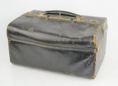 Lot 359 - A vintage black leather doctors bag with green...