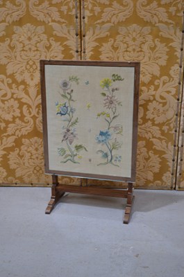Lot 590 - A Victorian needlework tapestry fire screen in...