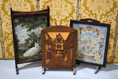 Lot 591 - A pair of vintage firescreens, one a...