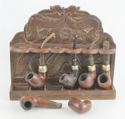 Lot 500 - An Oriental dragon design wooden smoking pipe...