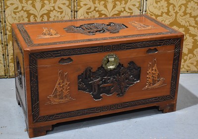Lot 623 - A large Chinese camphor wood chest, the carved...