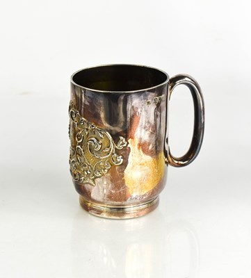 Lot 247 - A silver mug, embossed with a crest and...