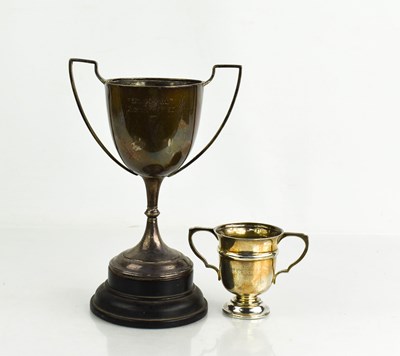 Lot 255 - Two silver trophies, one raised on an ebonised...