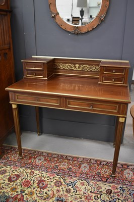 Lot 507 - A French Empire style bureau plat with brass...
