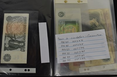 Lot 60 - A group of banknotes and coins to include six...