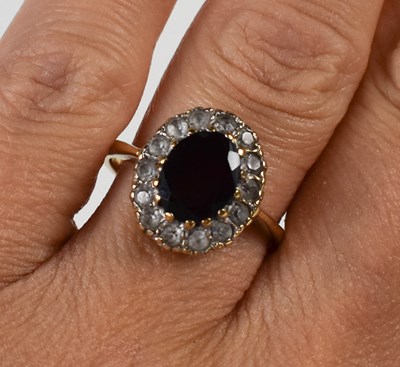 Lot 79 - A 9ct gold, garnet and cubic zirconia dress...