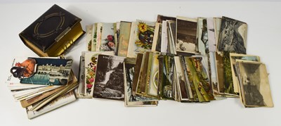 Lot 277 - An album of Victorian and later photographs,...