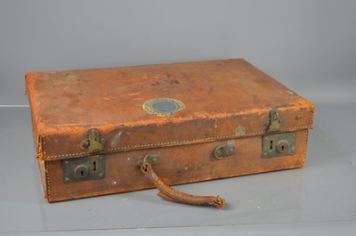 Lot 339 - A vintage leather suitcase, bearing initials...