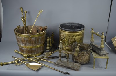 Lot 349 - A group of brassware to include fire irons,...