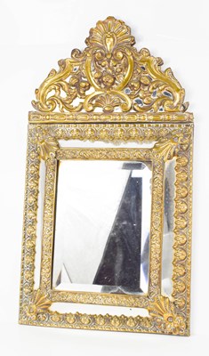 Lot 493 - A Venetian embossed brass wall mirror, with...