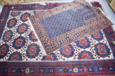 Lot 584 - A Middle Eastern rug, the larges having a...