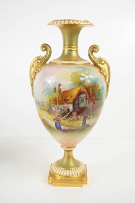Lot 226 - A Royal Worcester twin handled vase, painted...
