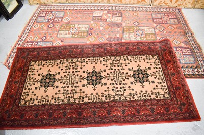 Lot 585 - Two Middle Eastern rungs, one with an orange...